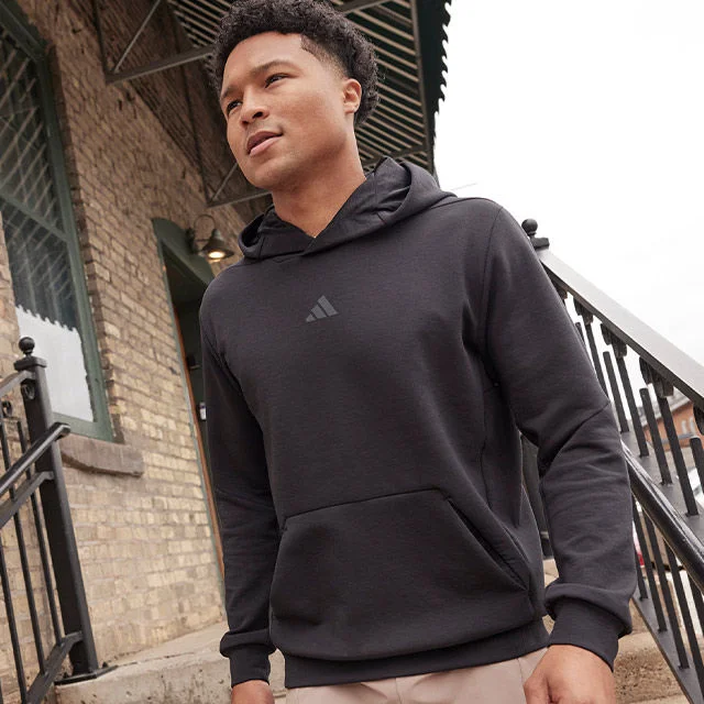 A man wearing an adidas hoodie.