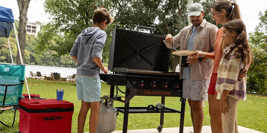 People grilling outdoors.