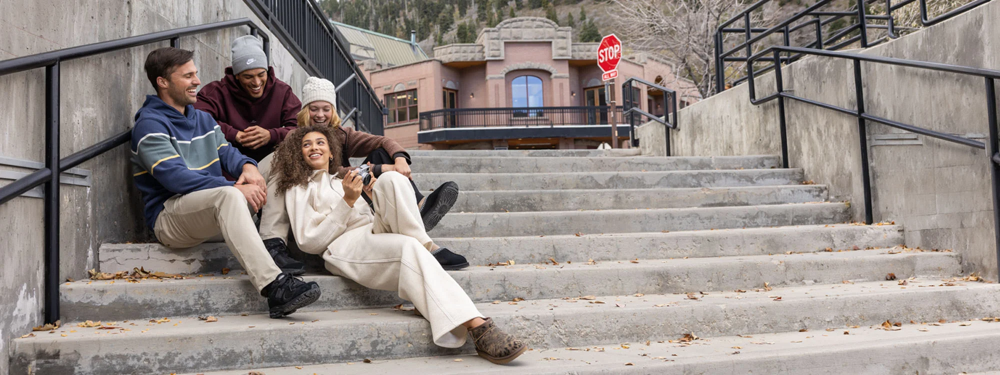 A group of friends hanging out on a set of stairs.