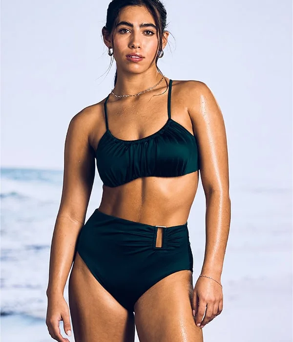 Woman in a two piece bathing suit. 