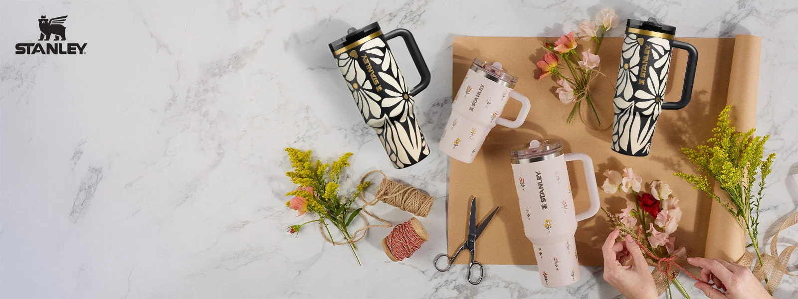 Stanley drinkware being wrapped on marble table top.