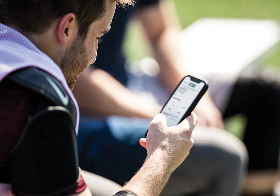 Person using smartphone outdoors