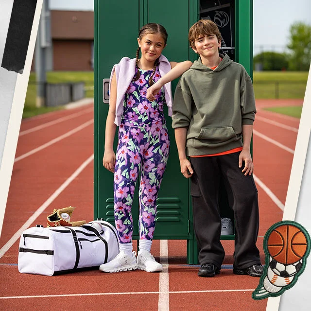 Boy and girl in new clothing sets.