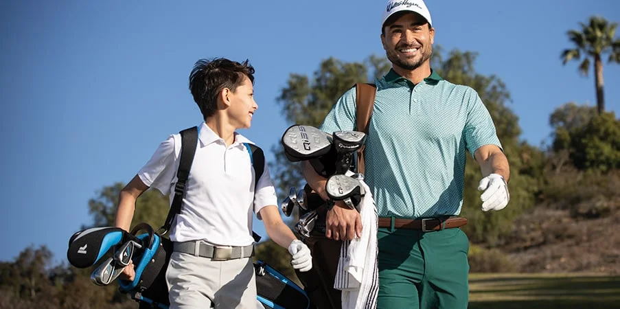 Dad and son golfing together. 