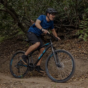 A man on a bicycle.
