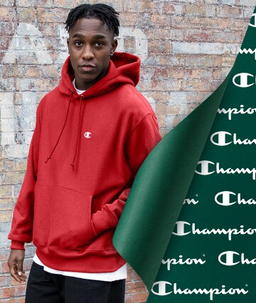 An athlete wearing a Champion hoodie.