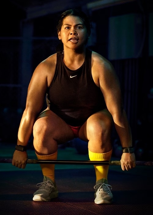 Woman weight training.