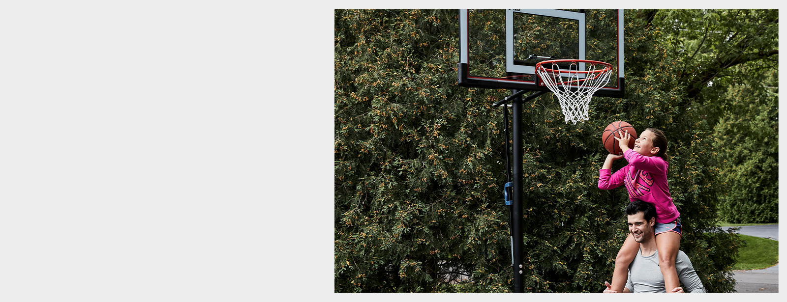 Father and daughter playing basketball.