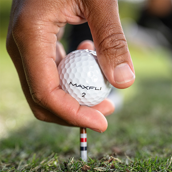 person picking up golf ball