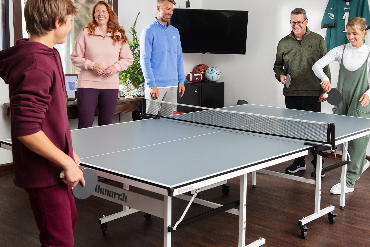 Family playing table tennis.