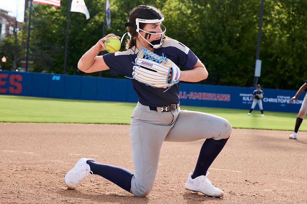 softball player kneeling down making play