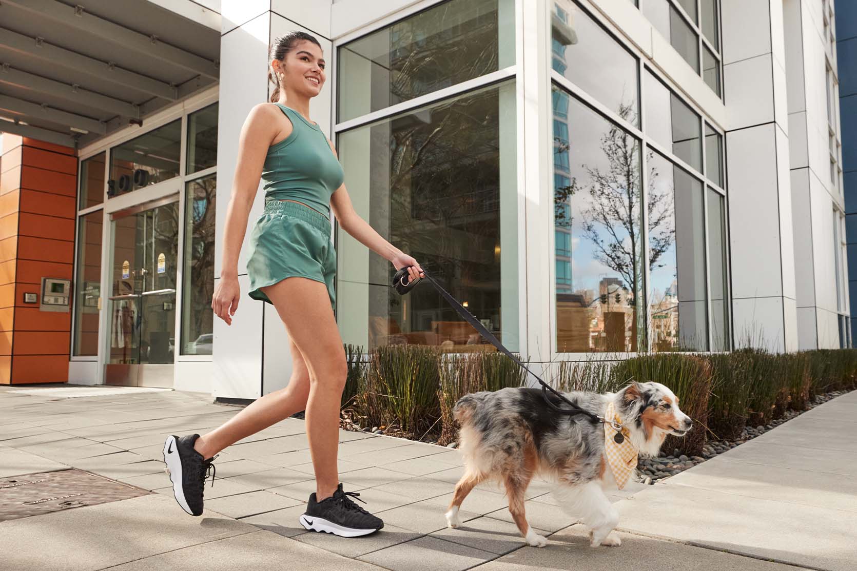 woman walking dog