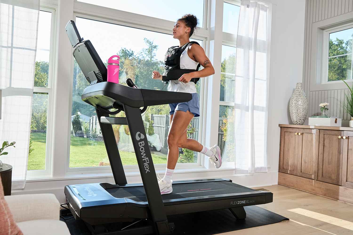 Women running on treadmill.