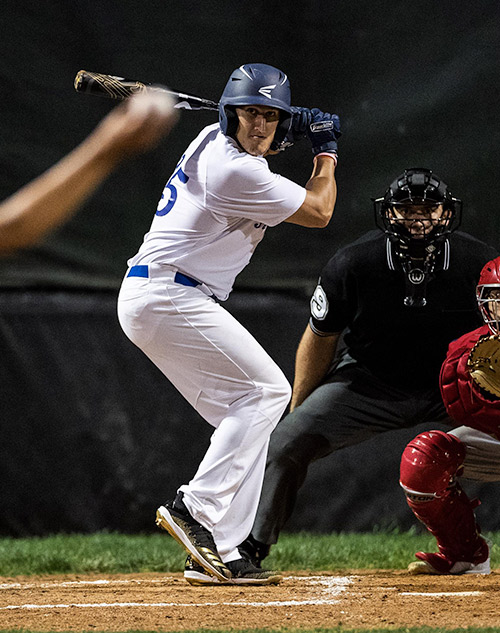 adult baseball player batting