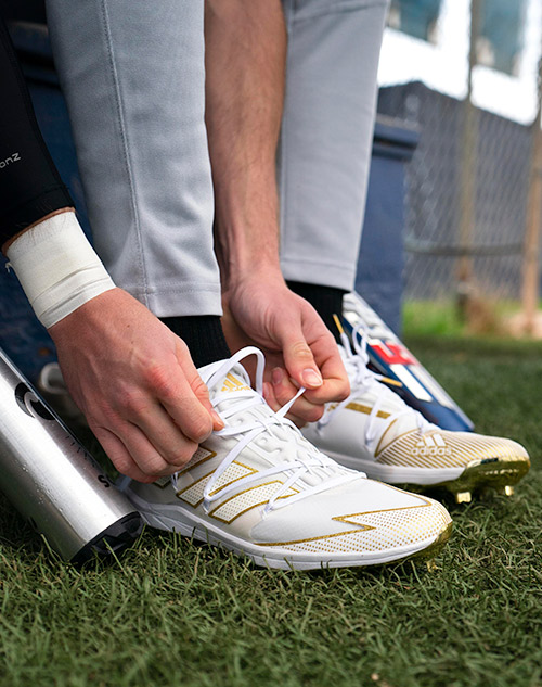 person tying cleats