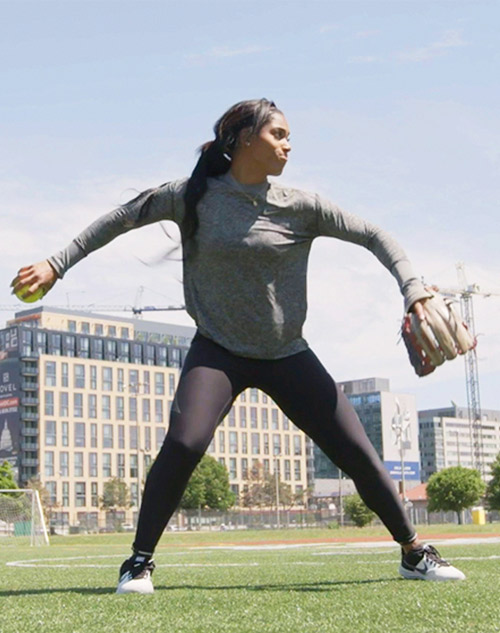 Aleshia Ocasio fielding a softball.