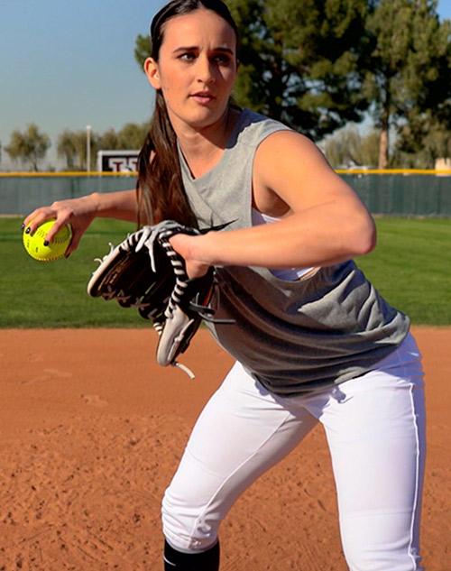 Delaney Spaulding throwing a softball