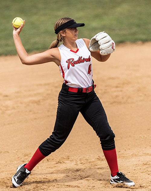 softball player throwing a ball