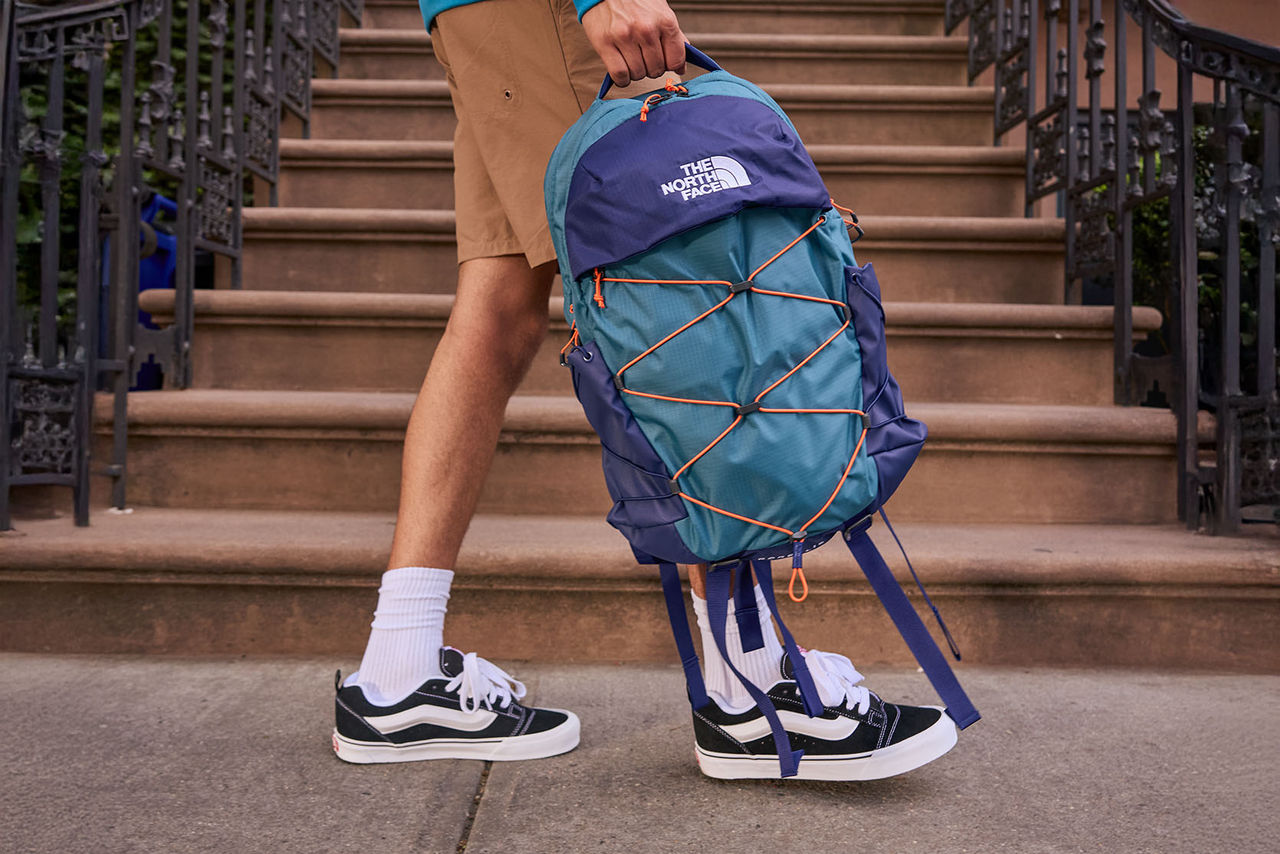 teen walking with backpack