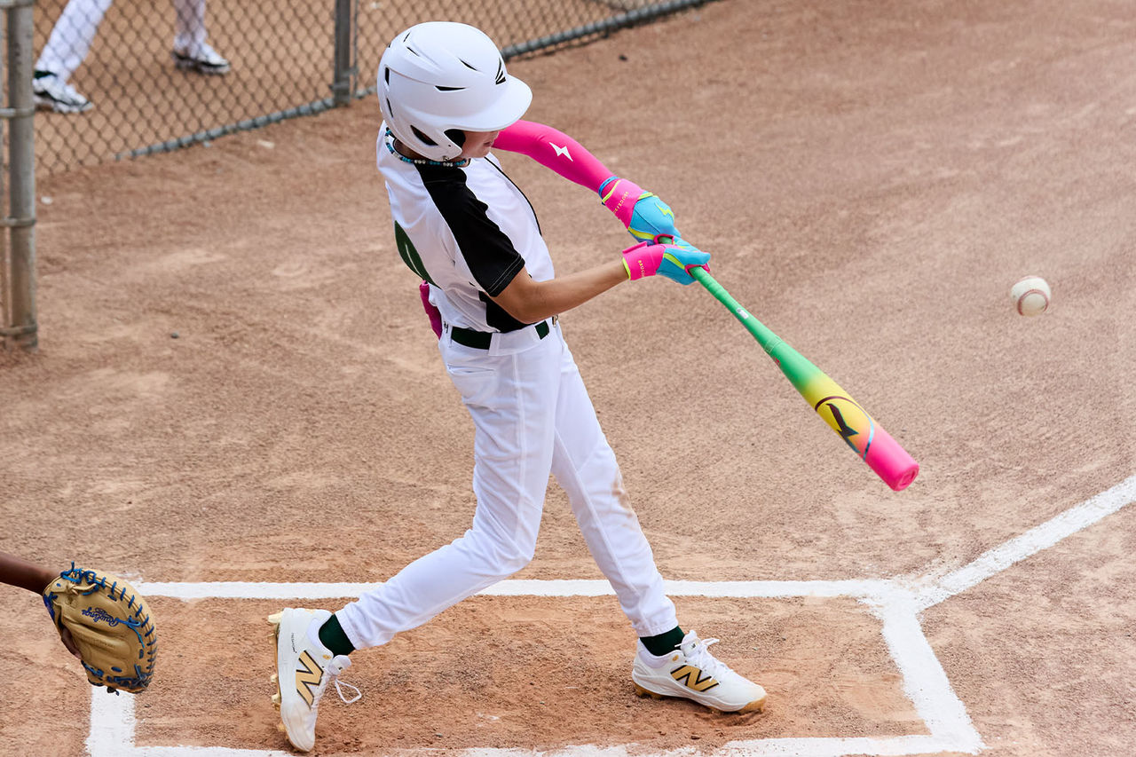 player swinging colorful bat