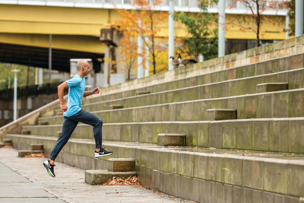 Man running up steps outdoors