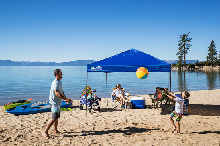 family playing on the beach