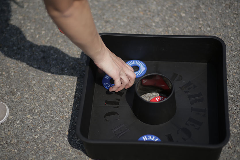 Picture of washer toss game on the ground.