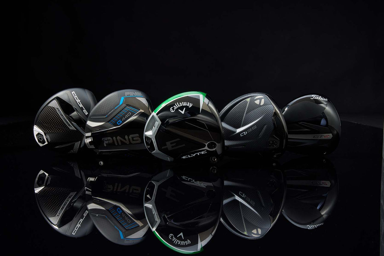 golf drivers on table