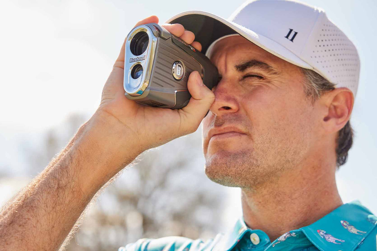 Golfer using a Bushnell Rangefinder