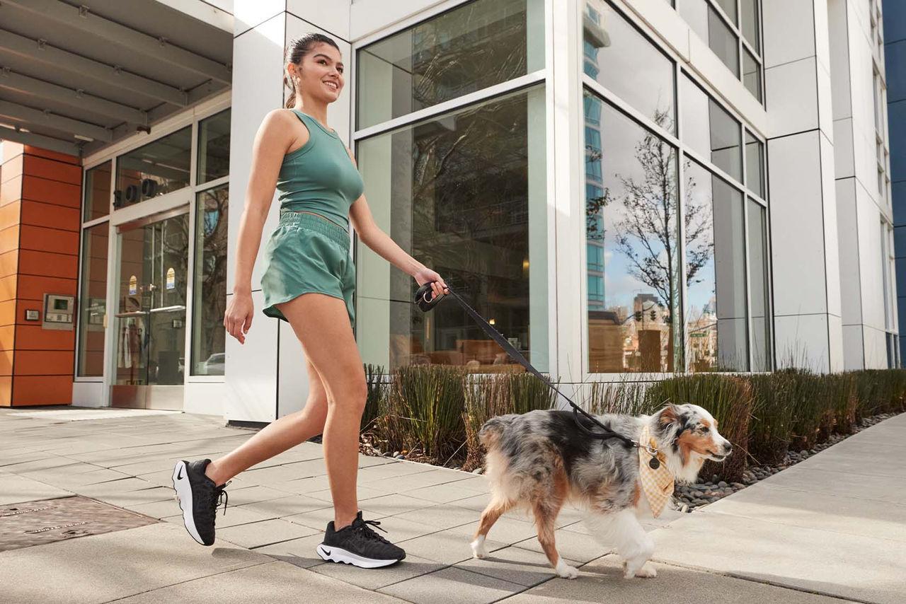 woman walking dog