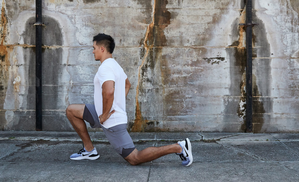 Man doing a hip flexor stretch