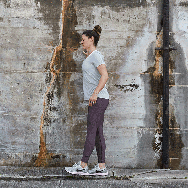 Female doing leg swings. 