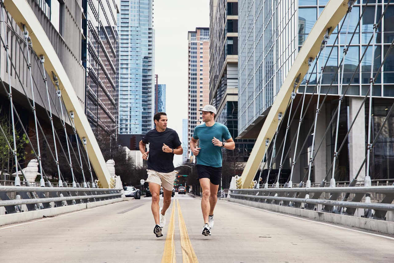 people running on street in urban setting