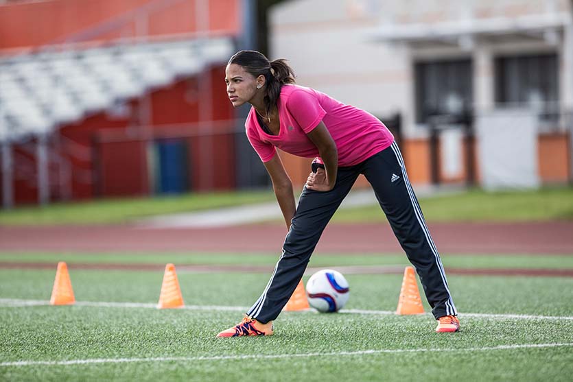 Women stretching on a soccer field