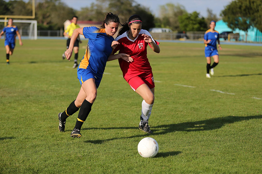 Two teams playing soccer