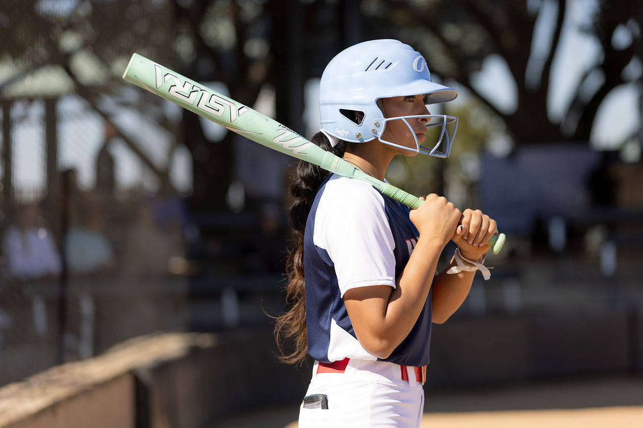Softball player with bat.