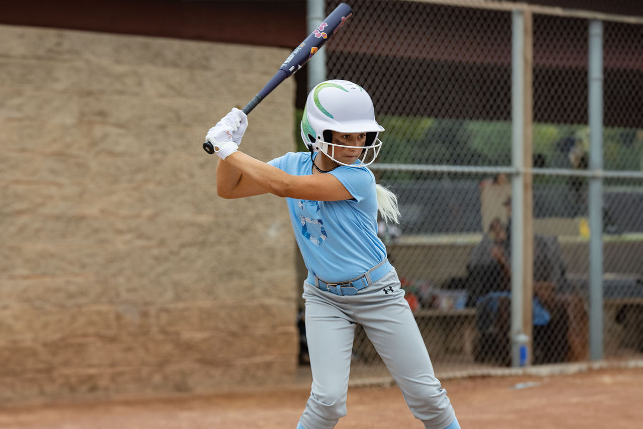Softball player batting
