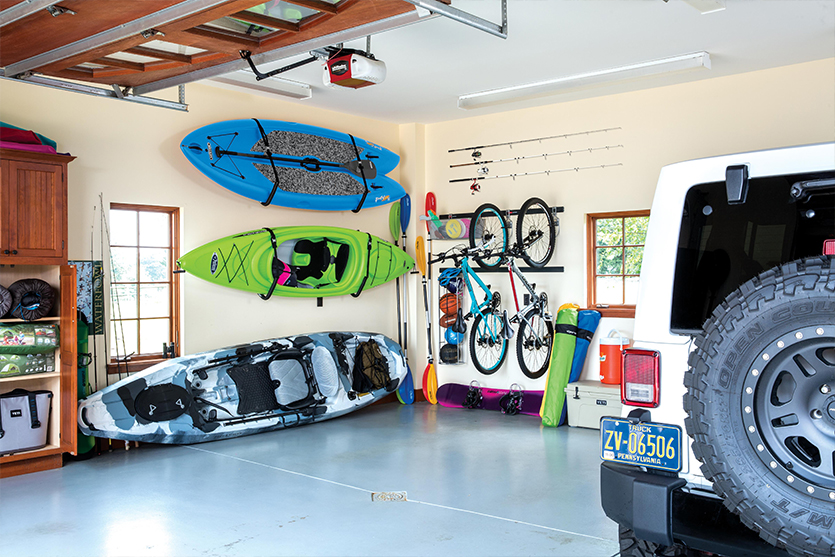 Hanging kayaks in shop garage